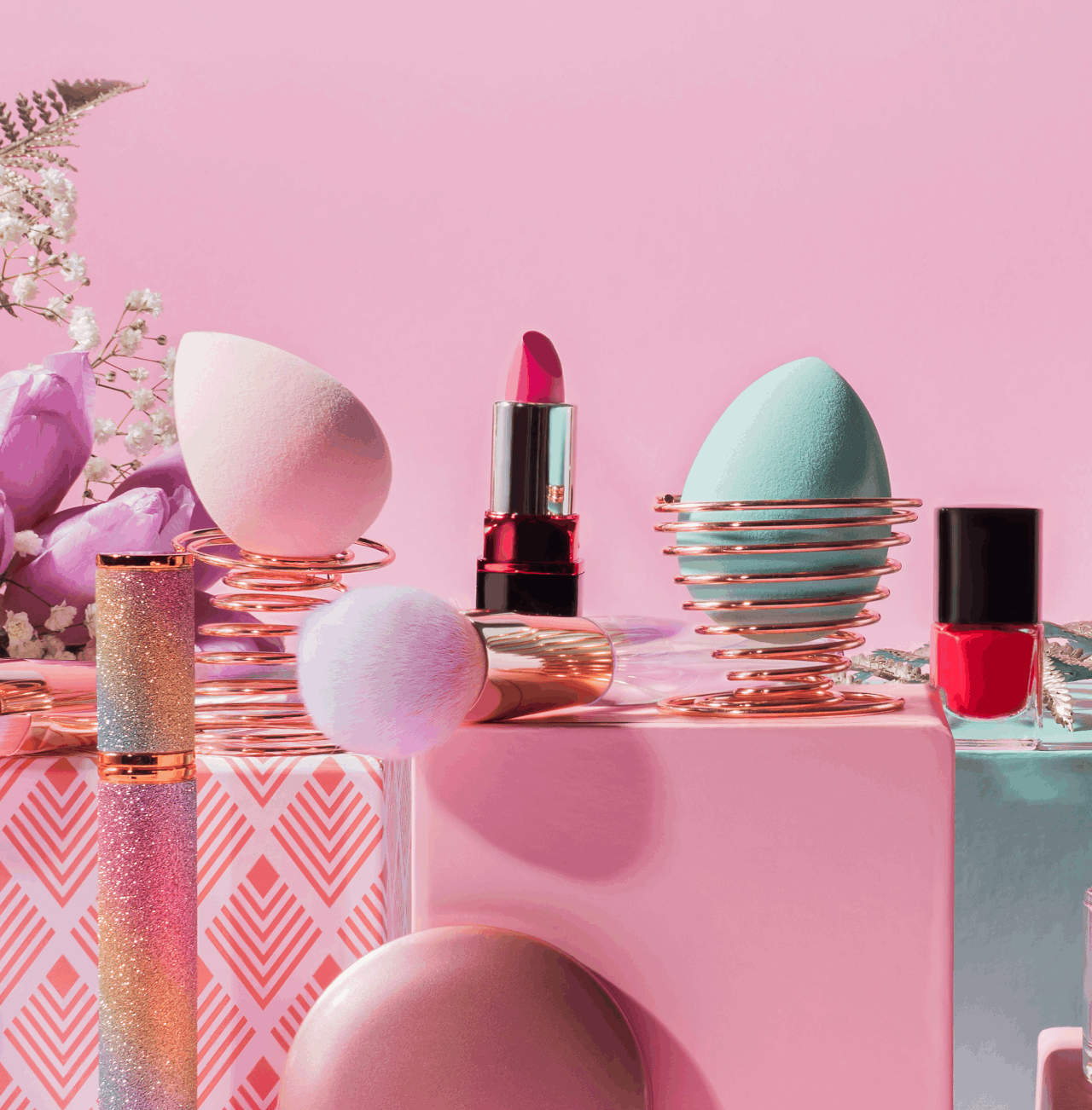 cosmetics-and-makeup-products-on-pink-background-2026-03-24-13-00-14-utc